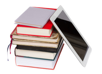 pile of books with modern tablet PC