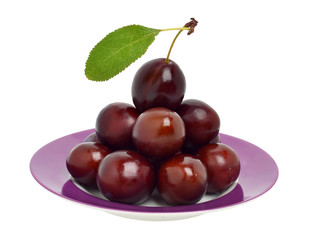 Ripe plums on the plate