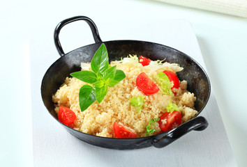 Couscous with salad greens and tomato