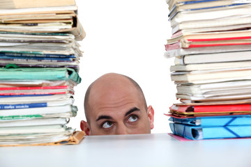 Man peering at files