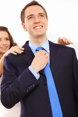 Businessman dressing at home in the morning