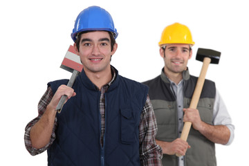 craftsman and apprentice posing together