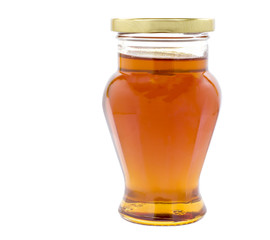Jar of honey isolated on white background