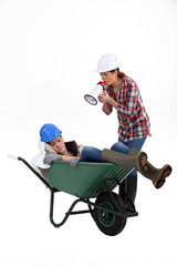 Woman with megaphone yelling at woman asleep