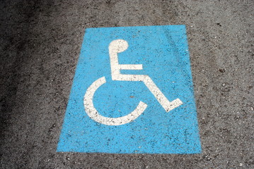 blue road marking for disabled and invalid parking