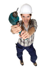 Woman with a power drill