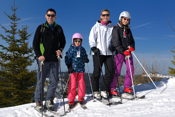 portrait of happy young family at winter