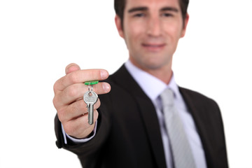 Estate agent with a house key