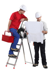 Two handymen working together