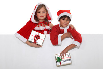 Festive children with a blank board