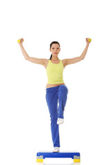 Fitness girl is working out with stepper