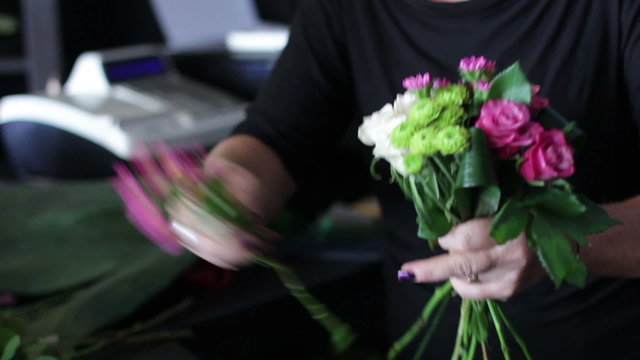 Female florist made a bouquet