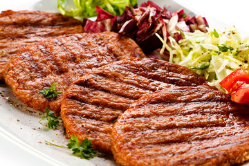 Grilled steaks and vegetables