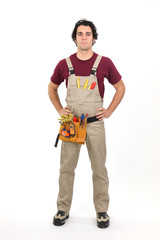 Handyman stood with hands on hips