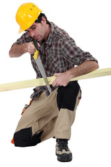 Carpenter with a handsaw