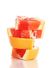 Sliced grapefruit isolated on white