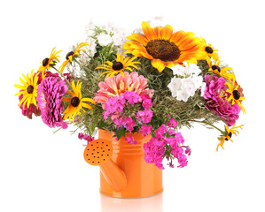 Beautiful bouquet of bright flowers in bailer isolated on white