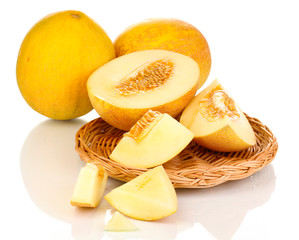 Ripe melons on wicker cradle isolated on white