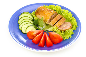 Tasty meat cutlet with garnish on plate isolated on white