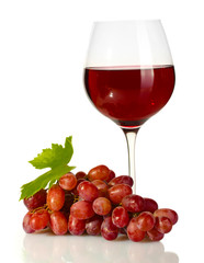 glass of wine and ripe grapes isolated on white