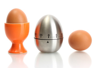 egg timer and egg in orange stand isolated on white