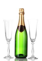Bottle of champagne and goblets isolated on white.