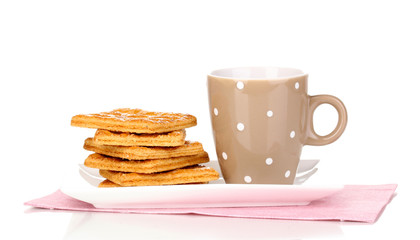 Cup of tea and cookies isolated on white