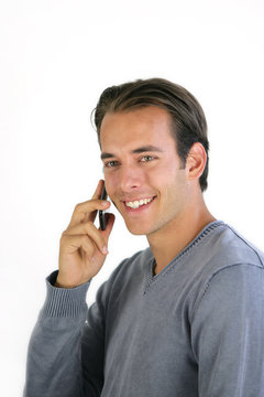 Smiling man talking on his mobile phone