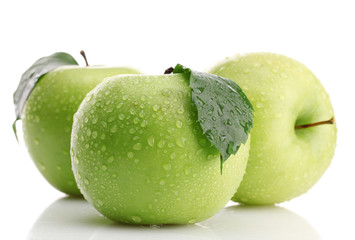 Ripe green apples with leaves  isolated on white