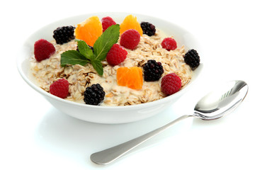tasty oatmeal with berries, isolated on white