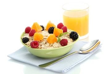 tasty oatmeal with berries and glass of juice, isolated on