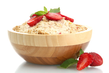 tasty oatmeal with strawberries, isolated on white