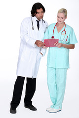 doctor and nurse examining a case