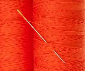 Orange thread with needle