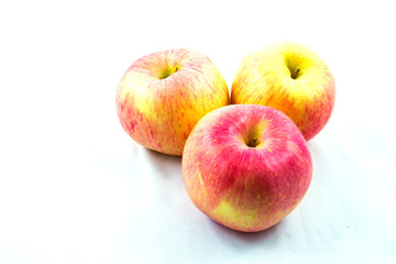 Three red apples