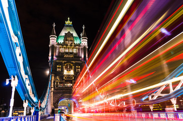 Tower Bridge in London, UK with moving red double-decker bus - obrazy, fototapety, plakaty