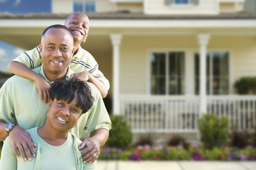 Attractive African American Family in Front of Home