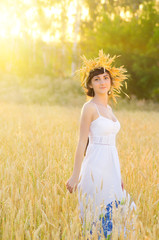 Fototapeta na wymiar Girl on wheat field