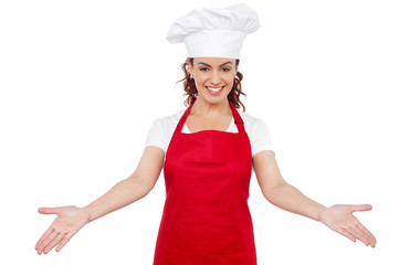 Smiling woman chef welcoming you