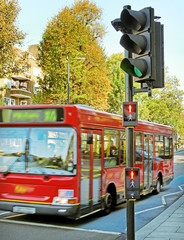Red bus on the street.