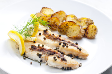 butterfish baked on pepper and anchovies