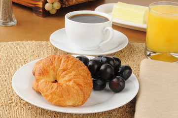 Croissant and grapes