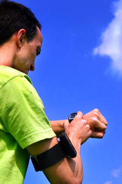 Young sporting boy with stopwatch