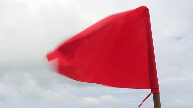 Red Flag warning message on Nai Thon beach. Phuket, Thailand.