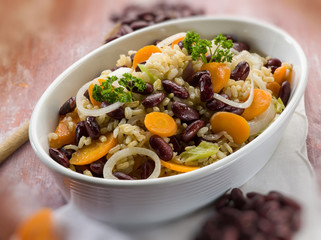 risotto with red beans carrots and onions, selective focus