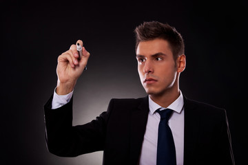 Business man writing with marker