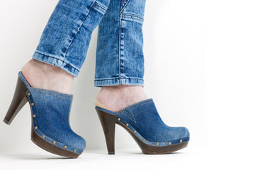 detail of woman wearing denim clogs