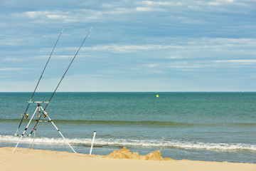 fishing rods on the beach in Narbonne Plage, Languedoc-Roussillo