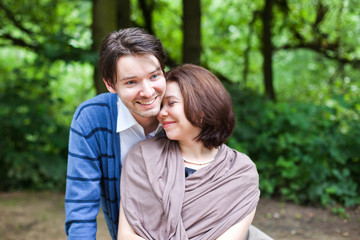 Fototapeta premium Young couple in love in summer forest