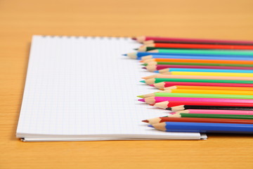 Pencils and checked notebook